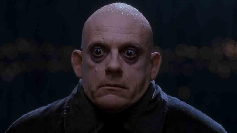 Fester Addams wide eyes