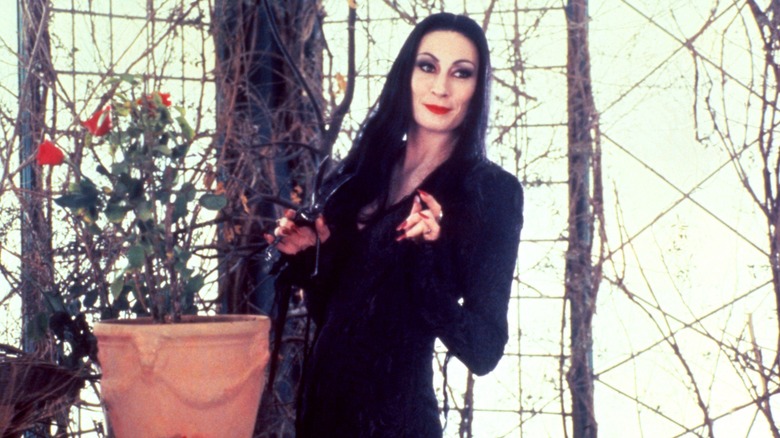 Morticia Addams trimming roses