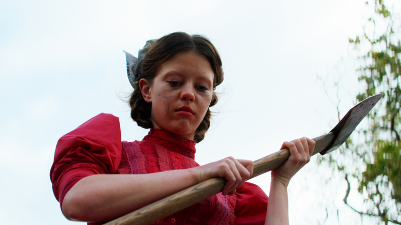 Mia Goth holding axe pearl