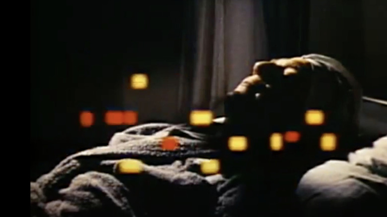 Harry Benson (George Segal) lies in his hospital bed in The Terminal Man