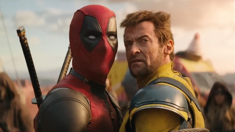 Ryan Reynolds and Hugh Jackman as Deadpool & Wolverine, standing close to one another in Deadpool & Wolverine