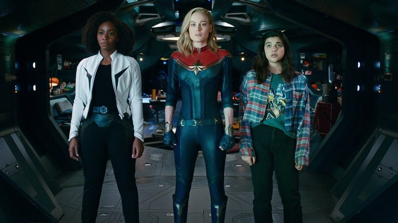 Monica Rambeau, Carol Danvers, and Kamala Khan stand next to each other in The Marvels