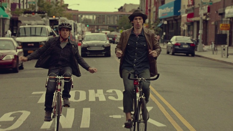 Ben Stiller and Adam Driver riding bikes