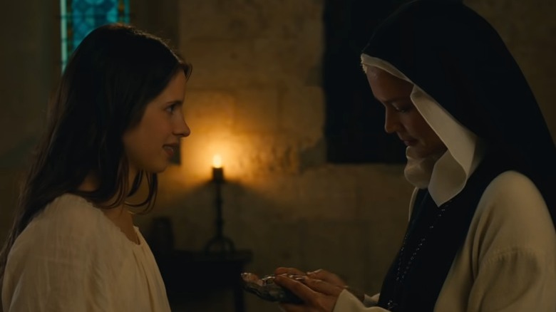 Daphne Patakia gives Virginie Efira a virgin Mary statuette in Bendetta