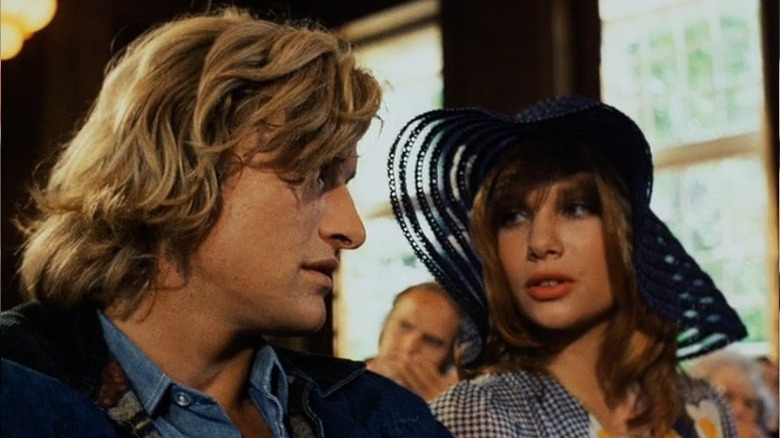 Rutger Hauer and woman in hat talk in Turkish Delight