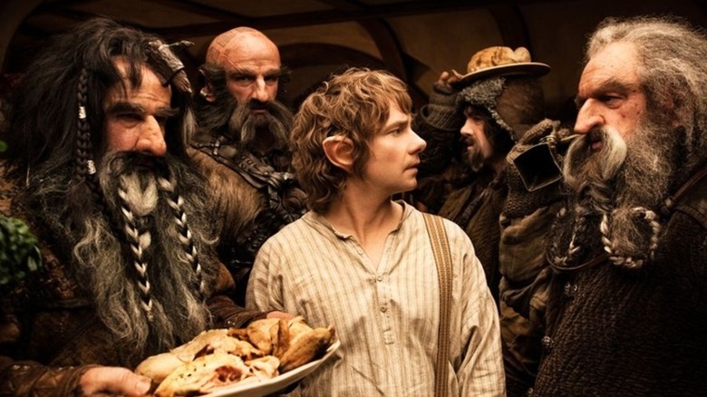 Bilbo surrounded by dwarves unexpected journey