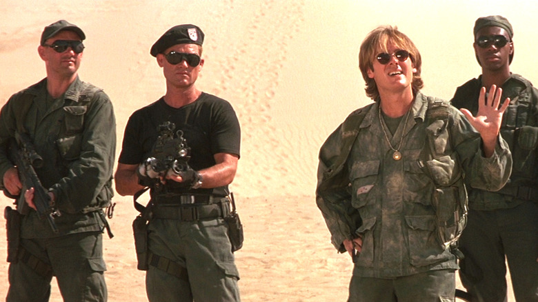 Soldiers in a desert look threatened