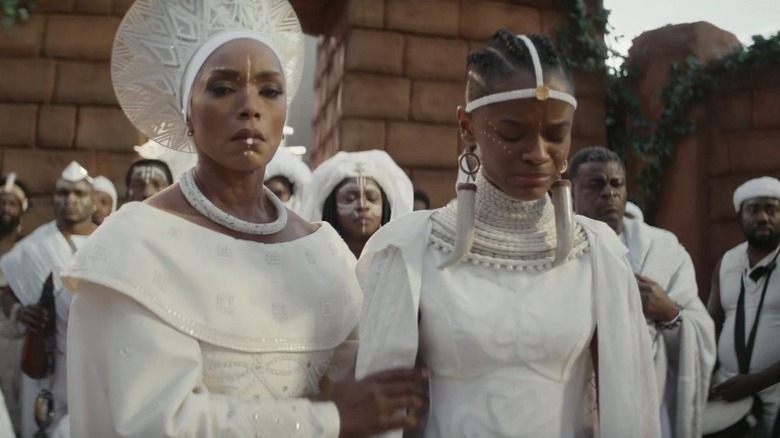 Queen Ramonda (Angela Bassett) and Shuri (Letitia Wright) mourn King T'Challa (Chadwick Boseman) in "Black Panther: Wakanda Forever"