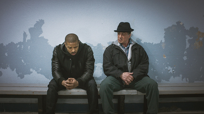 Adonis Johnson Creed (Michael B. Jordan) and Rocky Balboa (Sylvester Stallone) sit on a bench together in "Creed"