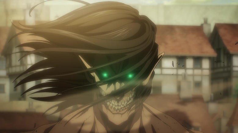Eren Titan grinning with green glowing eyes