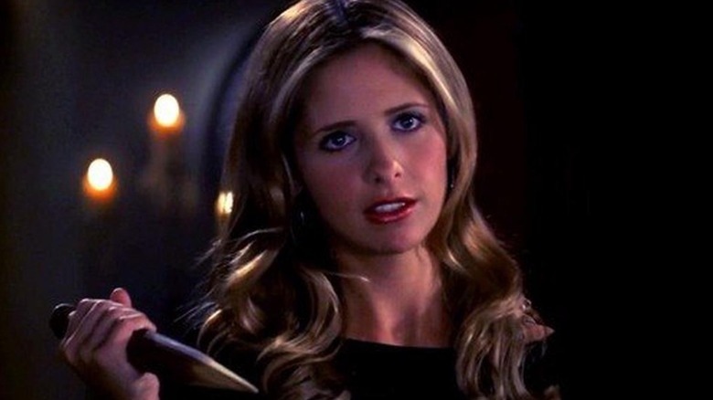 Buffy the Vampire Slayer holding a stake