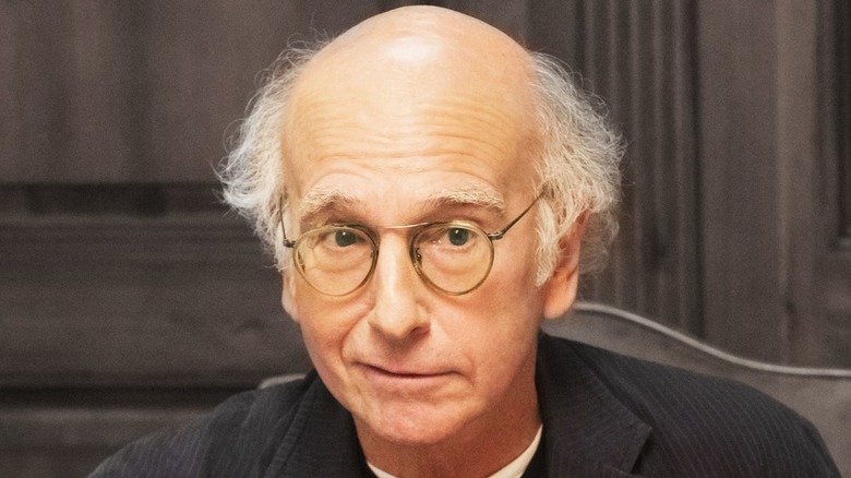 Larry David smirking