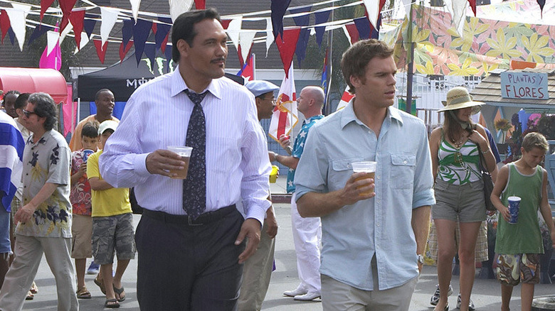 Jimmy Smitts and Michael C. Hall as Miguel and Dexter, drinking beer at a festival on Dexter