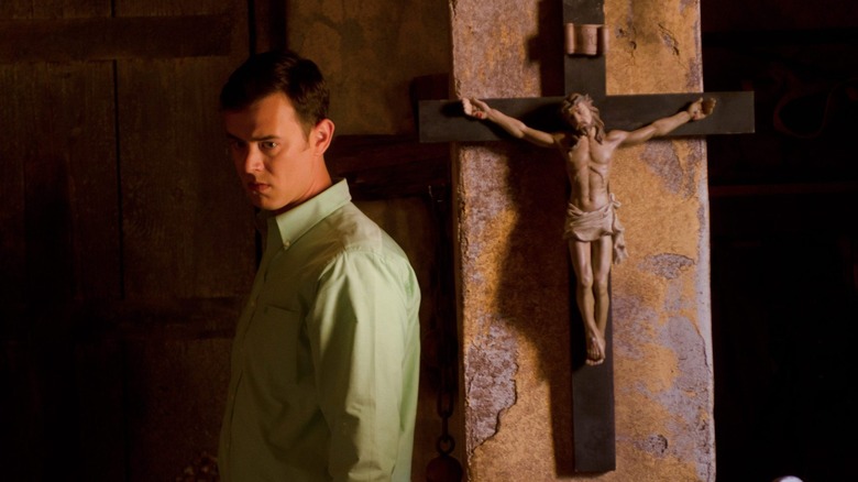 Colin Hanks as Travis Marshall standing in front of a crucifix on Dexter