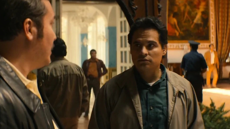 Michael Peña as Kiki Camarena during a raid on Narcos: Mexico