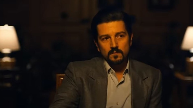 Diego Luna as Miguel Ángel Félix Gallardo wearing a suit and looking thoughtful on Narcos
