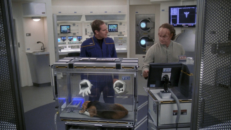 Captain Archer and Dr. Phlox looking at Porthos in a containment box on Star Trek: Enterprise