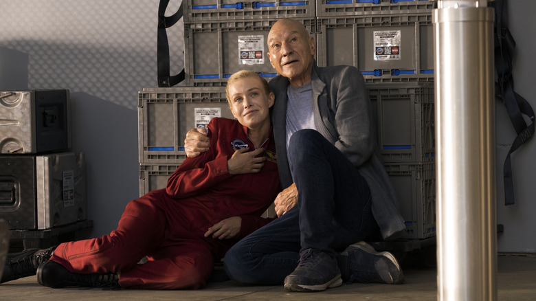 Renée (Penelope Mitchell) and Jean-Luc Picard (Patrick Stewart) on the floor of a storage room in Star Trek: Picard