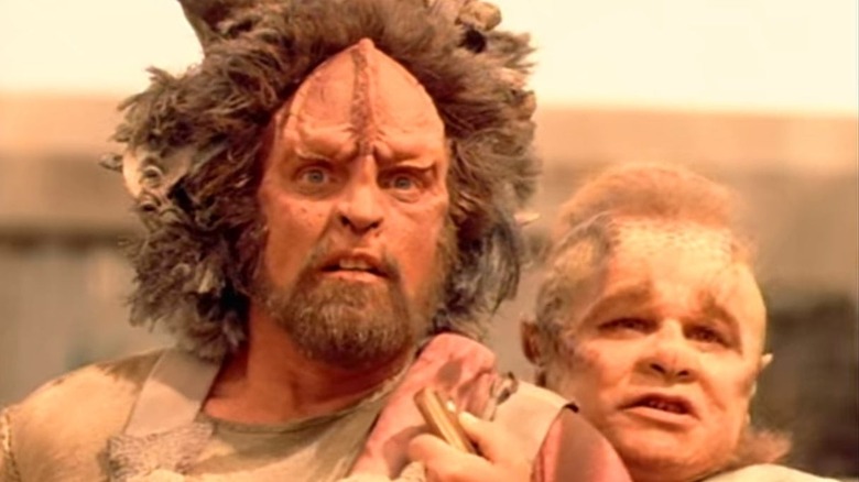 Neelix holds back a Kazon