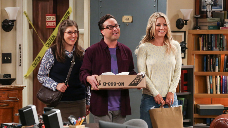 Amy Leonard and Penny standing in the apartment doorway on The Big Bang Theory