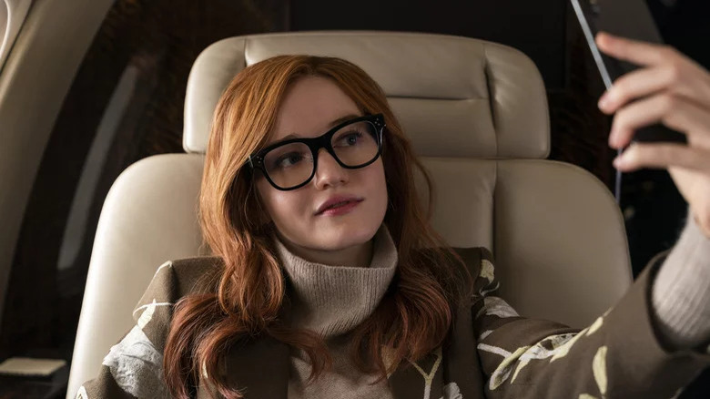 Inventing Anna's Anna Delvey taking selfie in car
