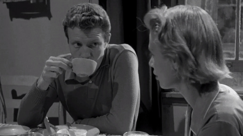 Davey Gordon (Jamie Smith) drinks coffee while Gloria Price (Irene Kane) talks in Killer's Kiss