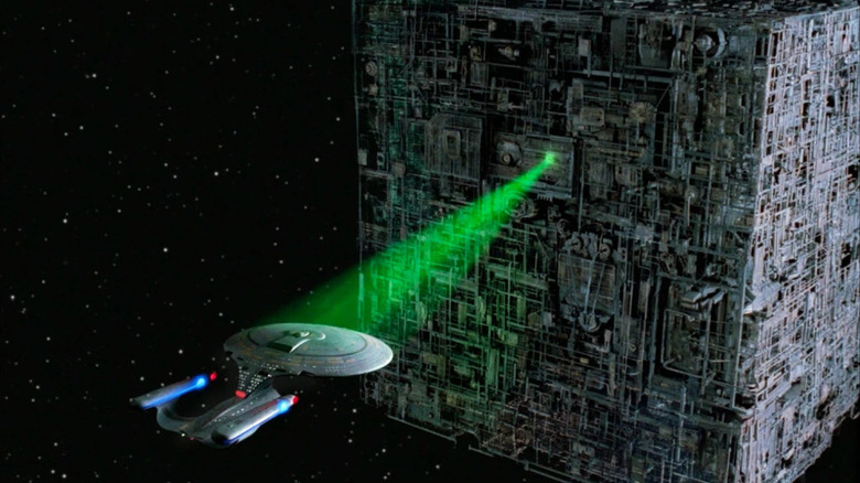 A borg ship captures the Enterprise in its tractor beam on Star Trek: The Next Generation