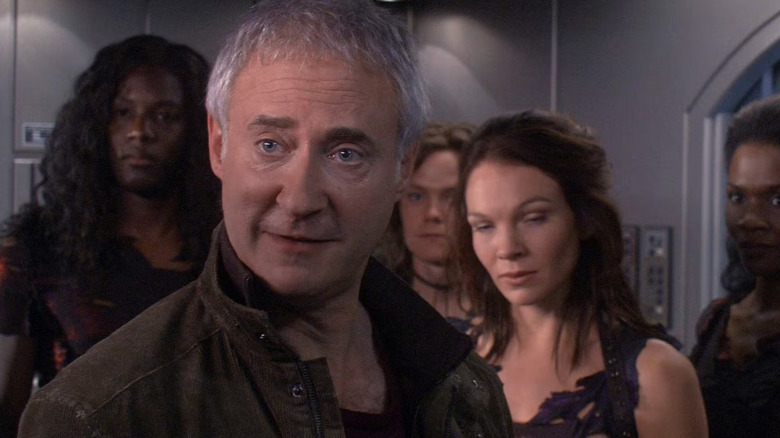 Arik Soong, standing with a group of genetically enhanced people