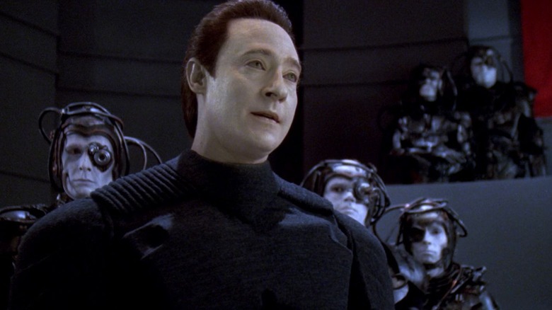 Lore, standing in a group of Borgs in an episode of Star Trek: The Next Generation.