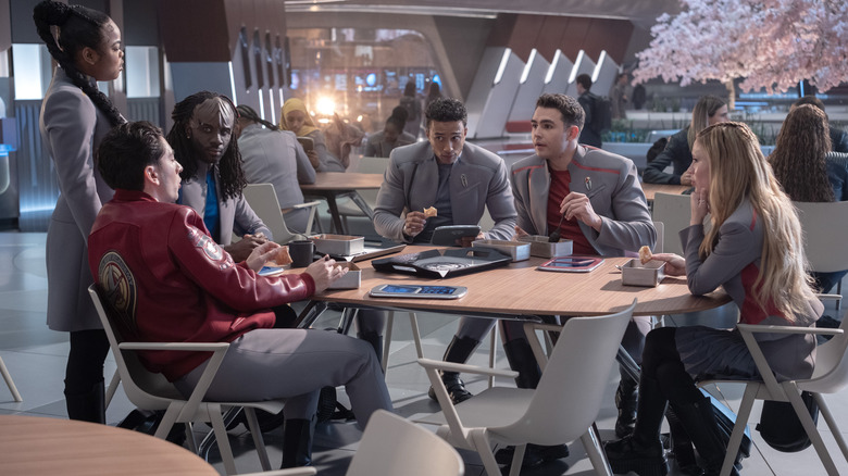 A group of students gathered around a table in Star Trek: Starfleet Academy