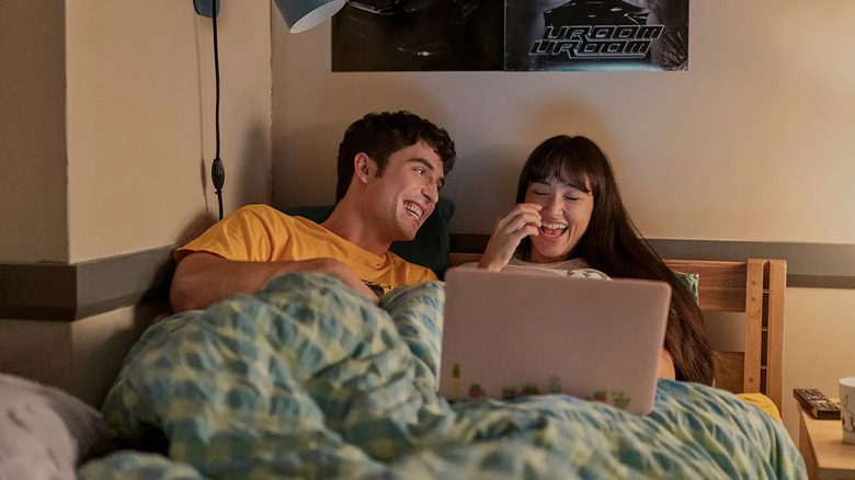 Carmen and Benny in a dorm room watching YouTube videos