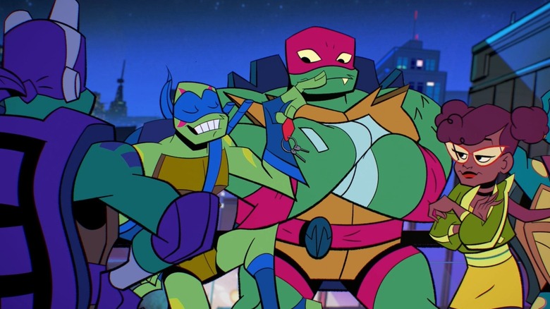 Leonardo dangles keys in front of Donatello, Raphael, and April