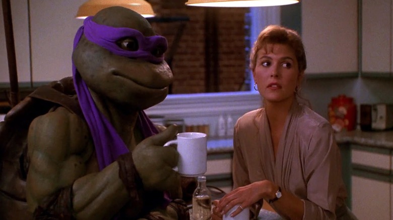 Donatello and April hold coffee cups