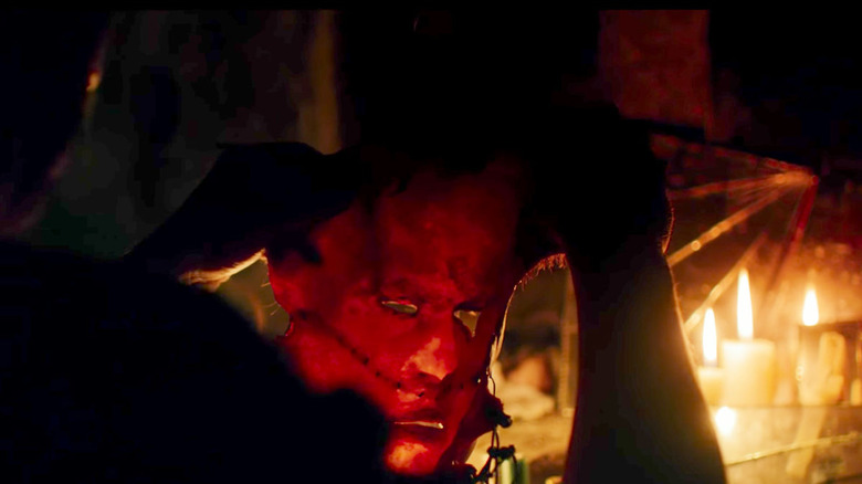 Leatherface stitching his original mask