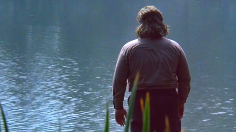 Leatherface standing by the water