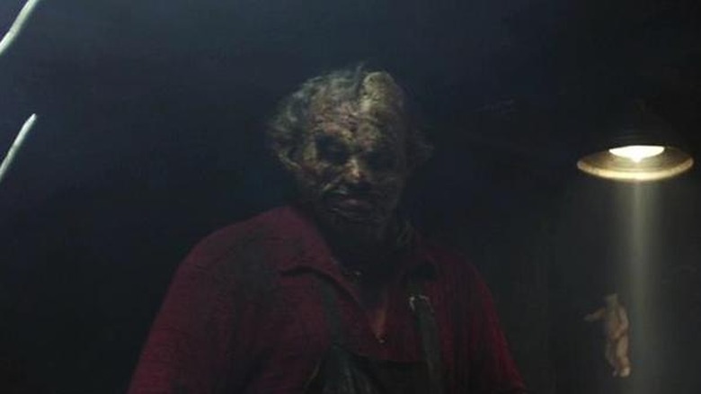 Leatherface lurking in the shadows