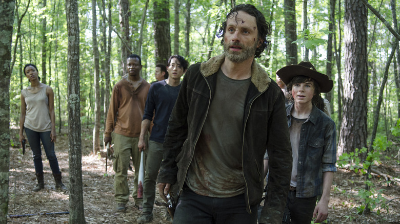 Rick and Carl in the woods with the group