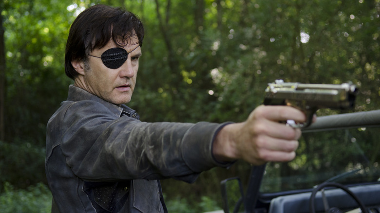 The Governor points a gun