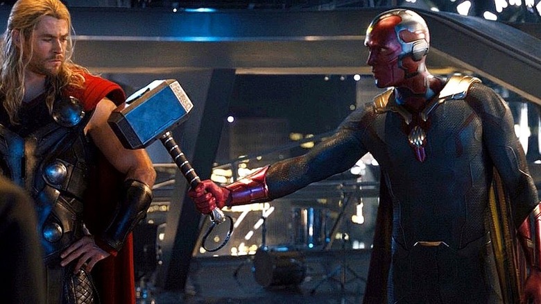VIsion (Paul Bettany) gives Thor (Chris Hemsworth) Mjolnir in Avengers: Age of Ultron