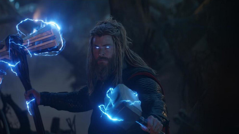 Thor (Chris Hemsworth) electrifies Stormbreaker and Mjolnir in battle in Avengers: Endgame