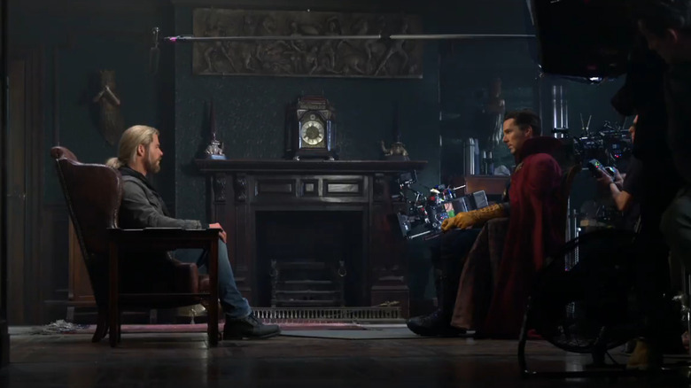 Thor (Chris Hemsworth) sitting talking to Steven Strange (Benedict Cumberbatch) in Dr. Strange