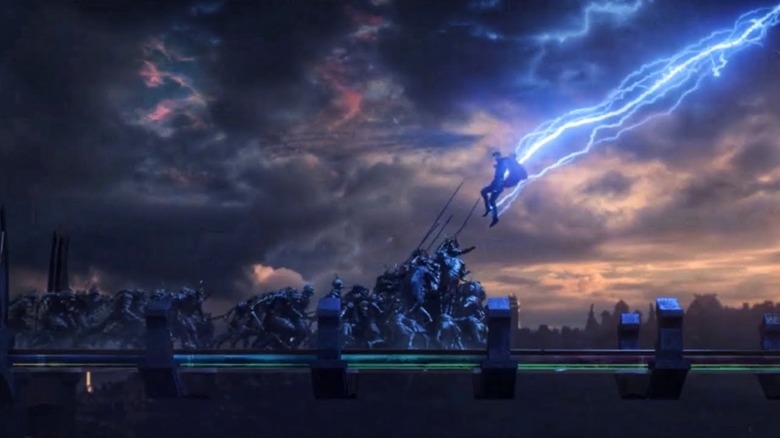 Thor (Chris Hemsworth) attacks a bridge filled with soldiers in Thor: Ragnarok