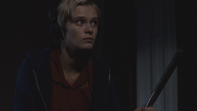 Sara Paxton wearing headphones