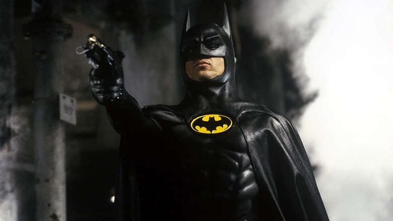 Batman pointing weapon