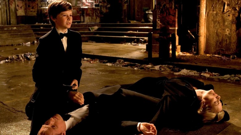 Batman Begins, young Bruce Wayne kneeling before his dead parents