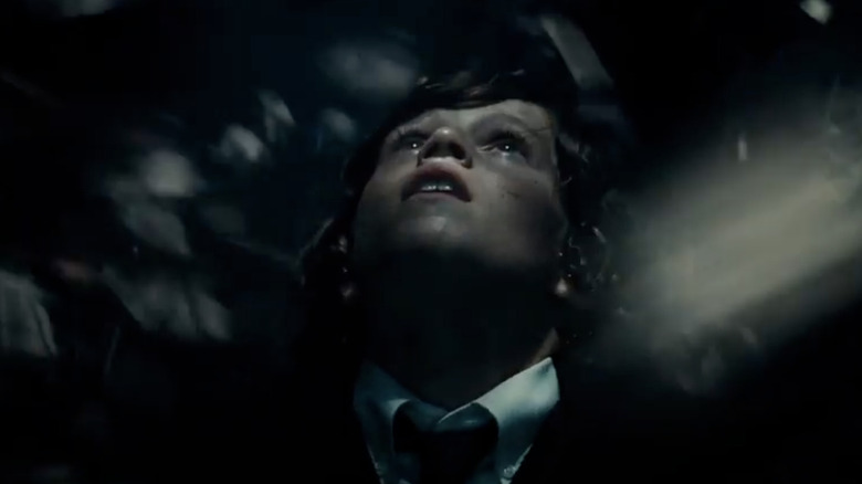 Batman v Superman: young Bruce Wayne in bat cave, looking up to the light