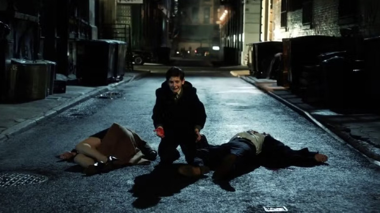 Gotham, young Bruce Wayne kneeling surrounded by his murdered parents