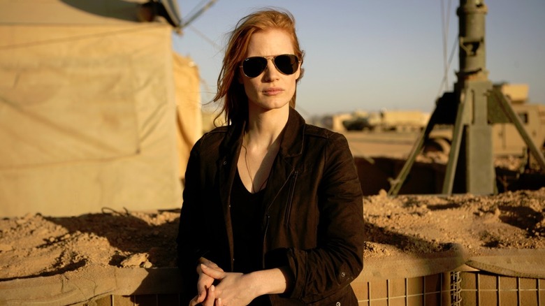 Jessica Chastain's Maya looks haunted, backlit by a strong light, in Zero Dark Thirty