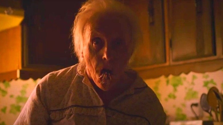 Old lady runner with Cordyceps protruding from her mouth on The Last of Us