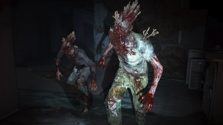 Two Infected stalkers walk toward the camera